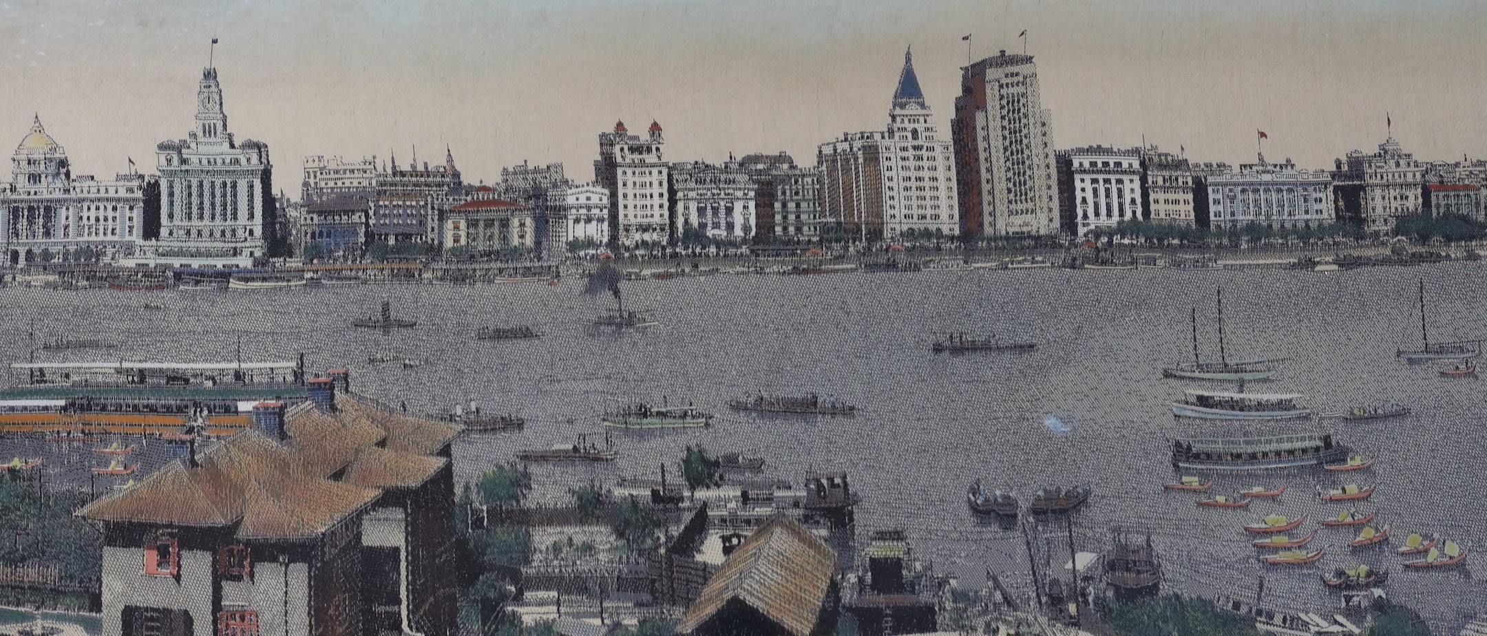 A framed early 20th century Chinese machine woven panorama of Shanghai harbour, 39x165cm excl frame